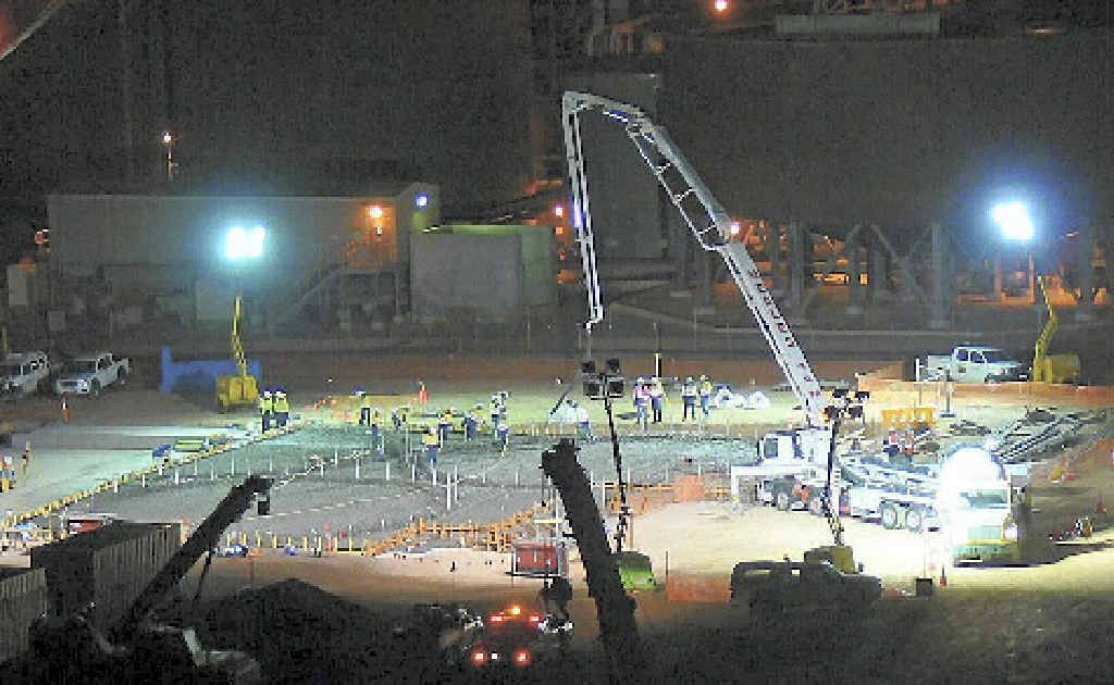 DAY AND NIGHT: Construction of the expansion at Rio Tinto Alcan Yarwun refinery was a massive effort. This photo shows the pouring of a 587-cubic-metre concrete slab. DAY AND NIGHT: Construction of the expansion at Rio Tinto Alcan Yarwun refinery was a massive effort. This photo shows the pouring of a 587-cubic-metre concrete slab.